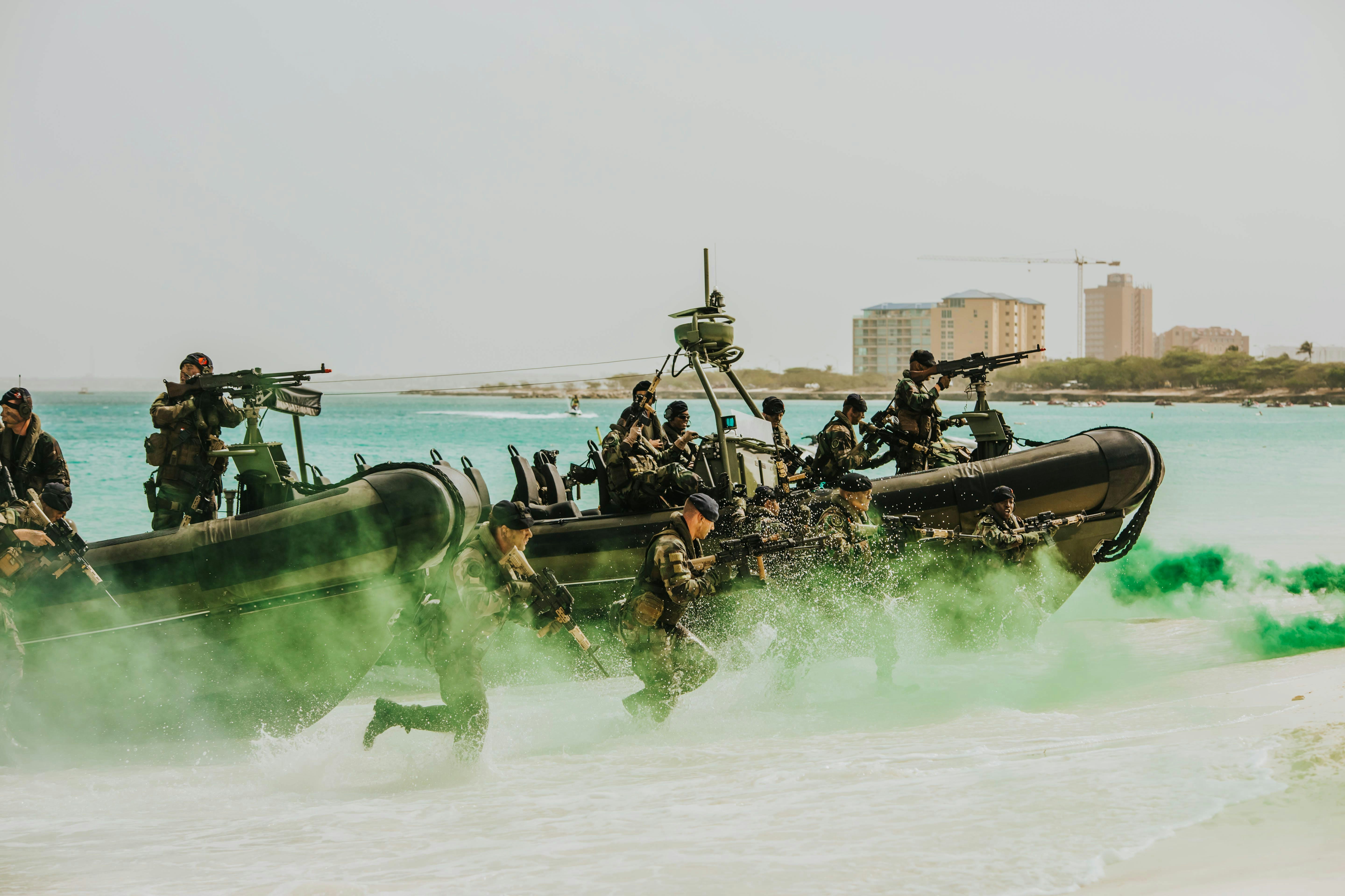 people riding on green boat during daytime